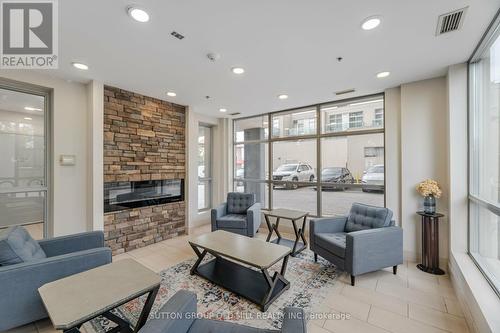 216 - 2464 Weston Road, Toronto, ON - Indoor Photo Showing Living Room With Fireplace