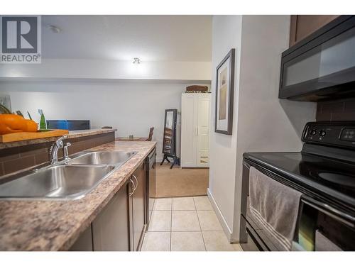 1500 Mcdonald Avenue Unit# 320, Fernie, BC - Indoor Photo Showing Kitchen With Double Sink