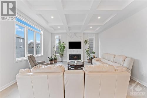 Picture perfect great room with modern Napoleon fireplace - 700 Coast Circle, Manotick, ON - Indoor Photo Showing Living Room With Fireplace