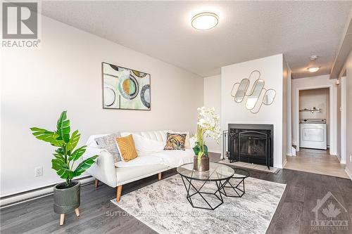 7 - 3415 Uplands Drive, Ottawa, ON - Indoor Photo Showing Living Room With Fireplace