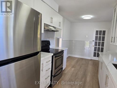 27 Unita Grove, Toronto, ON - Indoor Photo Showing Kitchen With Double Sink