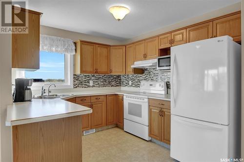 310 6 Lorne Place, Regina, SK - Indoor Photo Showing Kitchen With Double Sink