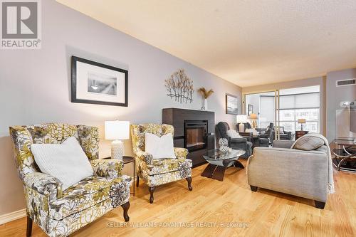 210 - 20 Guildwood Parkway, Toronto, ON - Indoor Photo Showing Living Room With Fireplace