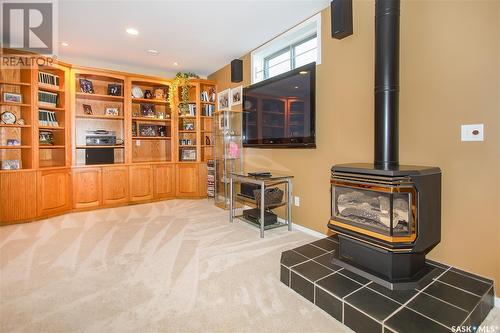 206 Braeshire Lane, Saskatoon, SK - Indoor Photo Showing Other Room With Fireplace