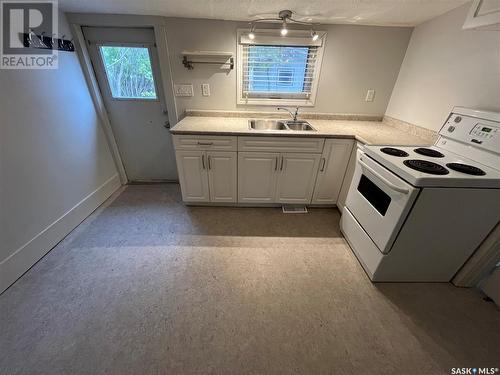 1076 4Th Avenue Ne, Moose Jaw, SK - Indoor Photo Showing Kitchen With Double Sink