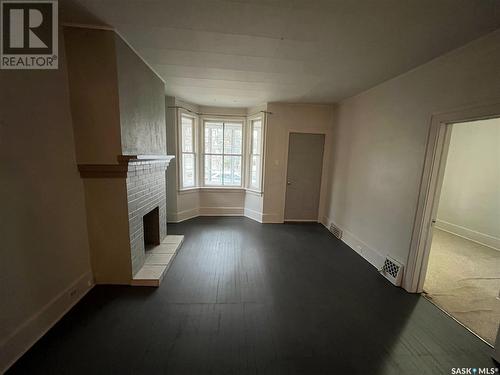 1076 4Th Avenue Ne, Moose Jaw, SK - Indoor Photo Showing Other Room With Fireplace