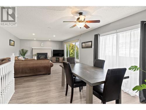 2196 Lynrick Road, Kelowna, BC - Indoor Photo Showing Dining Room With Fireplace