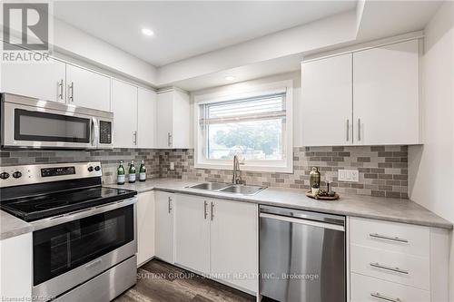 173 West 32Nd Street W, Hamilton, ON - Indoor Photo Showing Kitchen With Double Sink