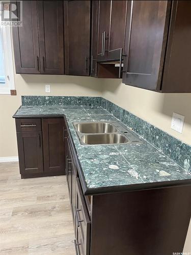 401 St Laurent Crescent, Saskatoon, SK - Indoor Photo Showing Kitchen With Double Sink