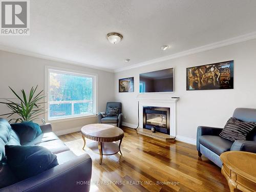 77 Rowntree Mill Road, Toronto, ON - Indoor Photo Showing Living Room With Fireplace