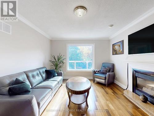 77 Rowntree Mill Road, Toronto, ON - Indoor Photo Showing Living Room With Fireplace