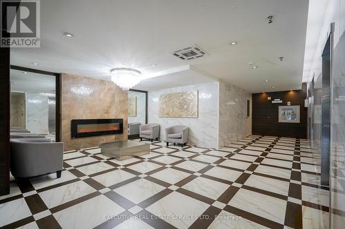 605 - 100 Wingarden Court, Toronto, ON - Indoor Photo Showing Other Room With Fireplace