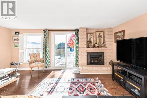 2 - 2052 Brant Street, Burlington, ON - Indoor Photo Showing Living Room With Fireplace