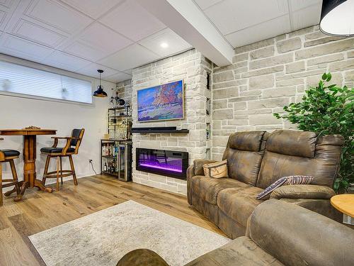 Salle familiale - 292 25E Avenue, Saint-Jérôme, QC - Indoor With Fireplace