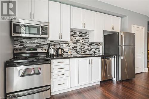 PARTY ROOM KITCHEN - 34 Plains Road E Unit# 208, Burlington, ON - Indoor Photo Showing Kitchen With Upgraded Kitchen