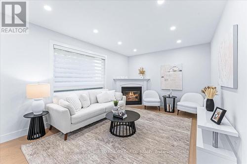 1043 Freeman Trail, Milton, ON - Indoor Photo Showing Living Room With Fireplace