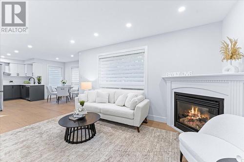 1043 Freeman Trail, Milton, ON - Indoor Photo Showing Living Room With Fireplace