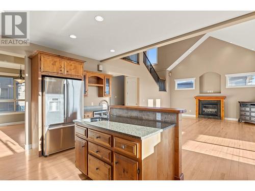 1294 Samurai Court, Kelowna, BC - Indoor Photo Showing Kitchen With Fireplace