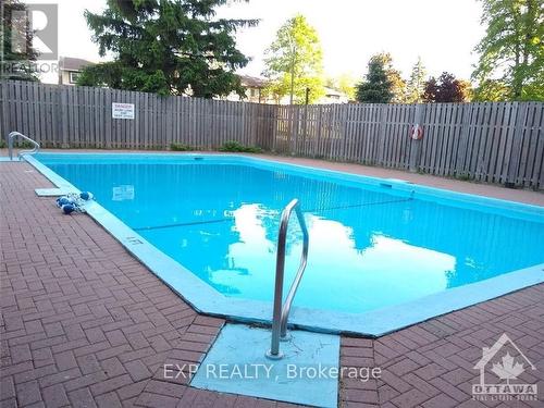 1907 - 1285 Cahill Drive, Ottawa, ON - Outdoor With In Ground Pool With Backyard