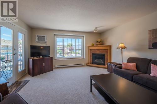 850 Railway Lane Unit# 201, Okanagan Falls, BC - Indoor Photo Showing Living Room With Fireplace