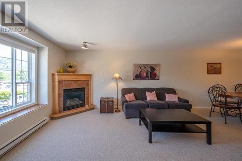 850 Railway Lane Unit# 201, Okanagan Falls, BC - Indoor Photo Showing Living Room With Fireplace