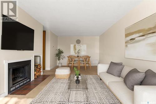 110 31 Rodenbush Drive, Regina, SK - Indoor Photo Showing Living Room With Fireplace