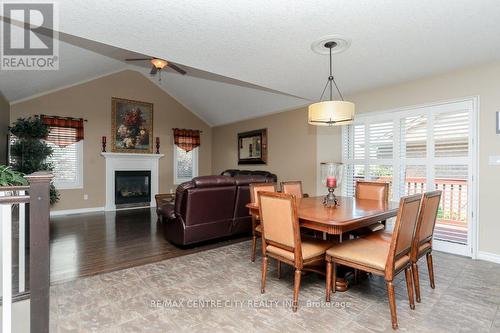 27 Peach Tree Boulevard, St. Thomas, ON - Indoor Photo Showing Dining Room With Fireplace