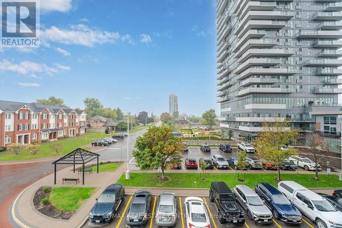 304 - 215 Queen Street E, Brampton, ON - Outdoor With Balcony With Facade