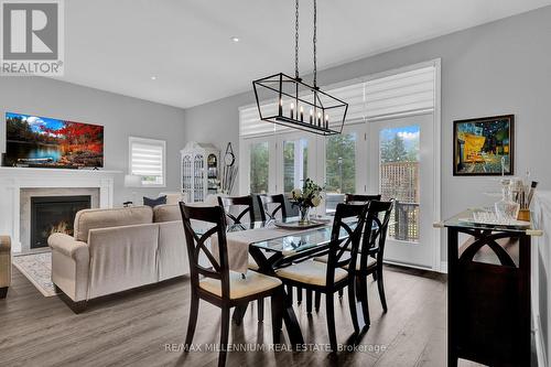 23 Sassafras Row, Fort Erie, ON - Indoor Photo Showing Dining Room With Fireplace