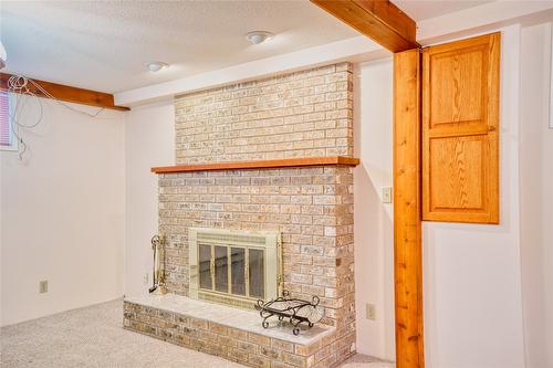 1477 Atkinson Street, Penticton, BC - Indoor Photo Showing Other Room With Fireplace