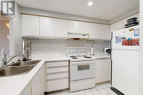 603 - 711 Rossland Road E, Whitby (Pringle Creek), ON - Indoor Photo Showing Kitchen With Double Sink