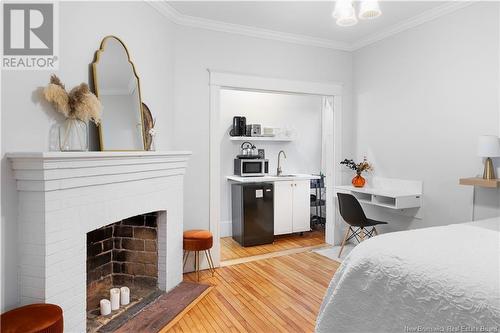 67-69 John Street, Moncton, NB - Indoor Photo Showing Bedroom With Fireplace