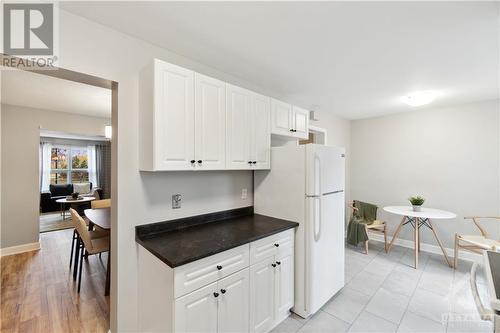 Kitchen w/ dining area & entrance to backyard - 3310 Southgate Drive Unit#245, Ottawa, ON - Indoor Photo Showing Kitchen