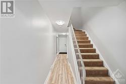 Hallway to kitchen/backyard and staircase upstairs - 