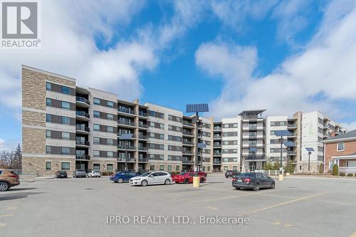 510 - 33 Whitmer Street, Milton, ON - Outdoor With Balcony With Facade