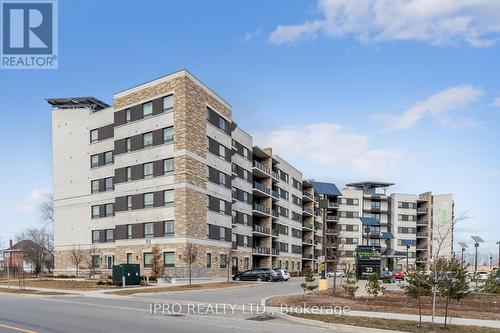 510 - 33 Whitmer Street, Milton, ON - Outdoor With Balcony With Facade