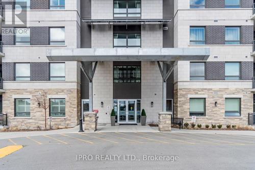 510 - 33 Whitmer Street, Milton, ON - Outdoor With Balcony With Facade