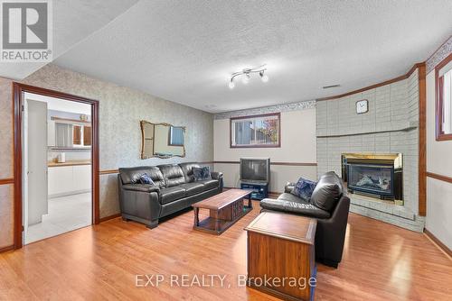 7737 Mount Carmel Boulevard, Niagara Falls, ON - Indoor Photo Showing Living Room With Fireplace