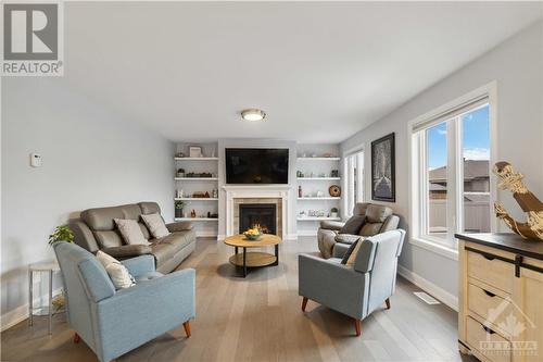 223 Station Trail, Russell, ON - Indoor Photo Showing Living Room With Fireplace