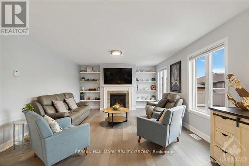 223 Station Trail, Prescott And Russell, ON - Indoor Photo Showing Living Room With Fireplace