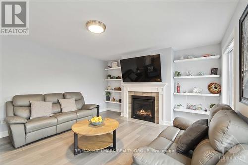 223 Station Trail, Prescott And Russell, ON - Indoor Photo Showing Living Room With Fireplace