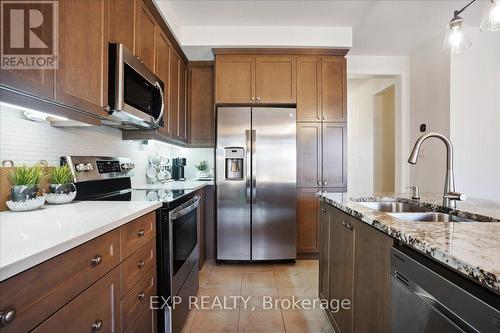 1429 Sycamore Gardens, Milton, ON - Indoor Photo Showing Kitchen With Stainless Steel Kitchen With Double Sink With Upgraded Kitchen