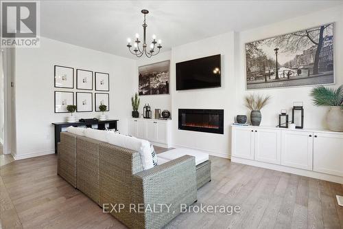 1429 Sycamore Gardens, Milton, ON - Indoor Photo Showing Living Room With Fireplace