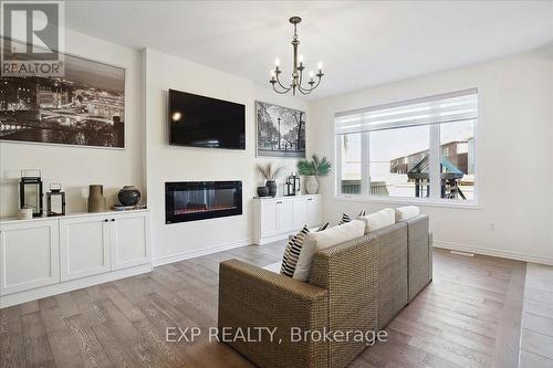 1429 Sycamore Gardens, Milton, ON - Indoor Photo Showing Living Room With Fireplace