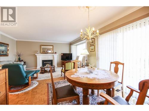 16 Yucca Place, Osoyoos, BC - Indoor Photo Showing Dining Room With Fireplace