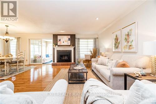 21 Glen Abbey Crescent, Ottawa, ON - Indoor Photo Showing Living Room With Fireplace