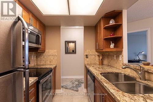 520 - 1001 Cedarglen Gate, Mississauga, ON - Indoor Photo Showing Kitchen With Double Sink