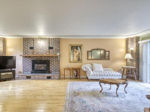 Salle familiale - 139 Boul. De L'Assomption, Repentigny (Repentigny), QC - Indoor Photo Showing Living Room With Fireplace