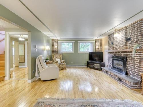 Salle familiale - 139 Boul. De L'Assomption, Repentigny (Repentigny), QC - Indoor Photo Showing Living Room With Fireplace