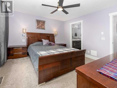 344 Quarry Park Boulevard Se, Calgary, AB - Indoor Photo Showing Bedroom